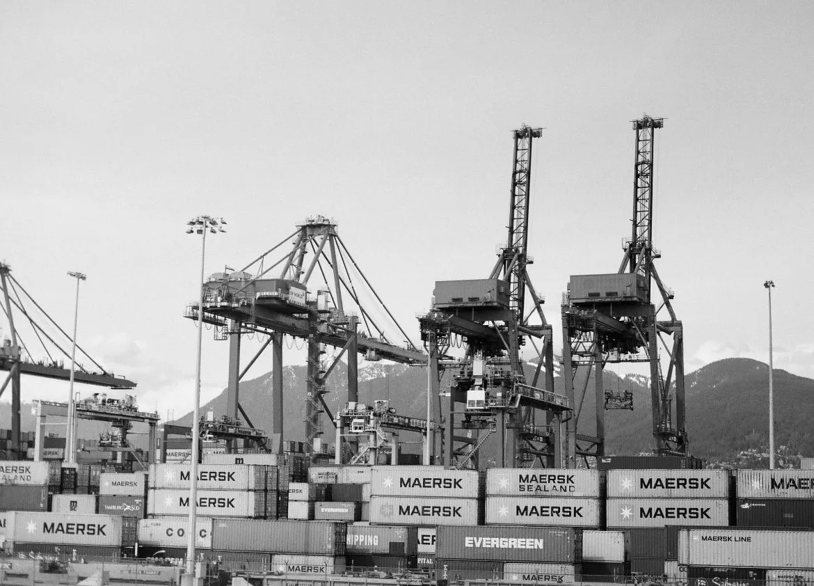 Container port cranes loading a ship