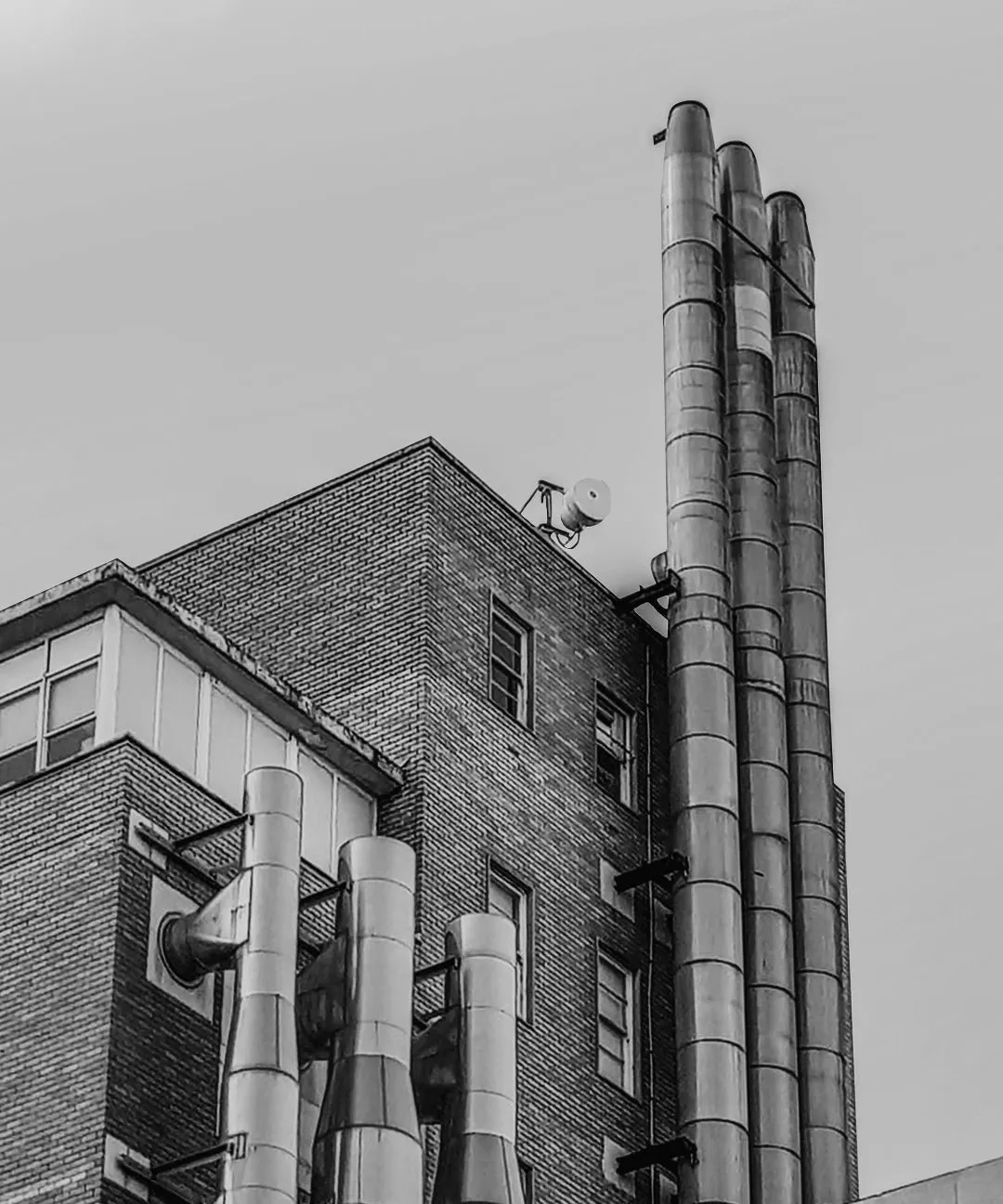 Industrial chimney stacks at a processing plant
