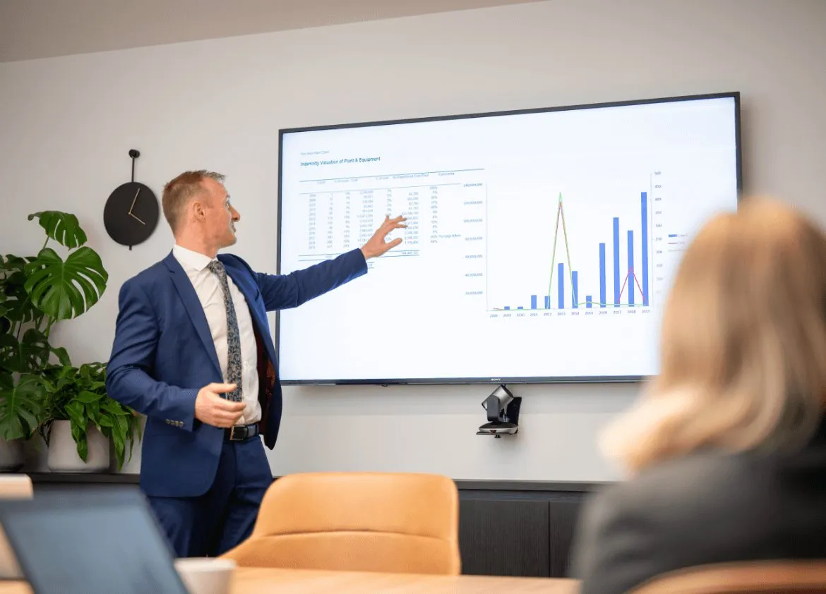 Valuer and client reviewing valuation figures